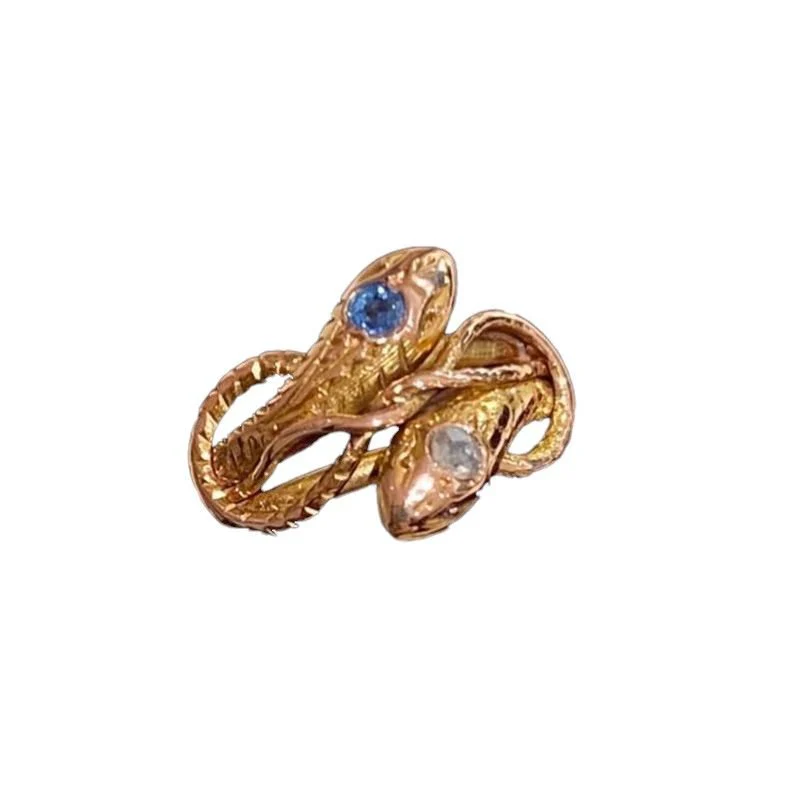 Bague ancienne à deux têtes de serpents en or rose 18k