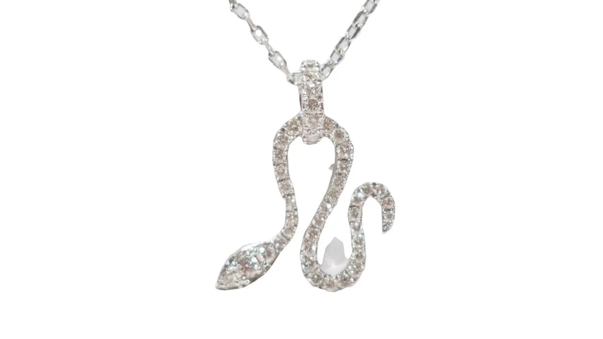 Collier Messika "Snake" en or blanc et diamants