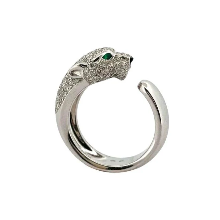 Bague Panthère CARTIER " Massai" en or blanc émeraudes, onyx et diamant