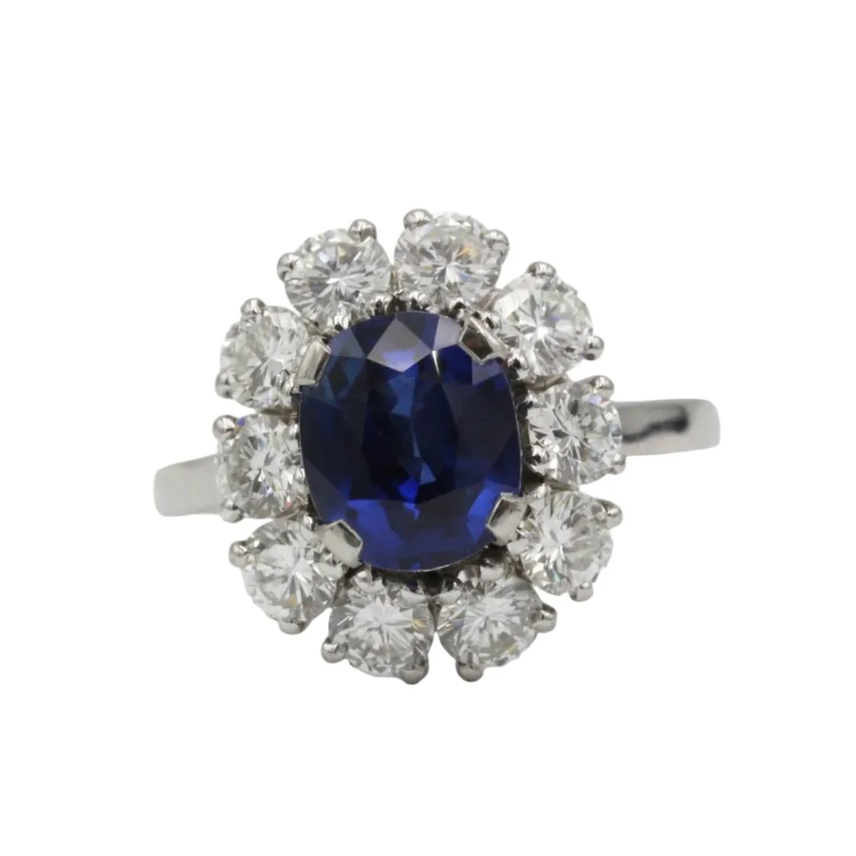 Bague Marguerite en or blanc, platine, saphir et diamants
