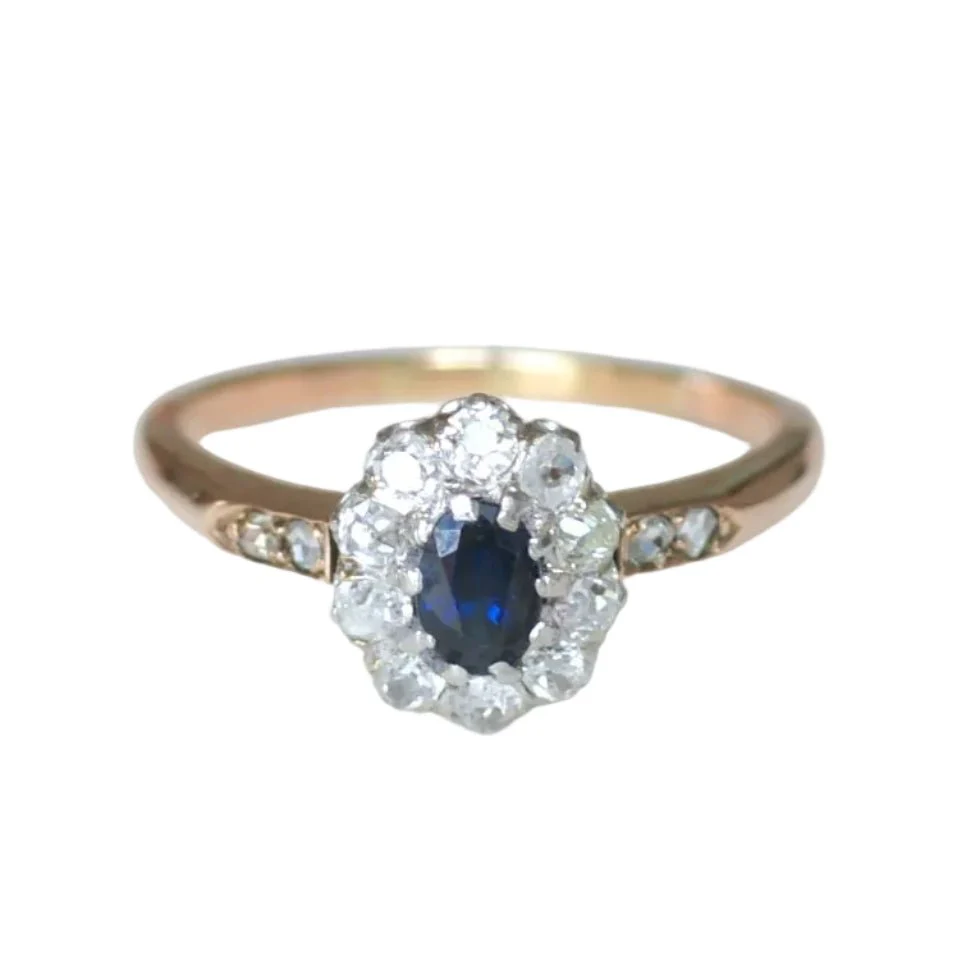 Bague Marguerite en or rose, platine, saphir et diamants