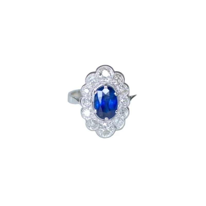 Bague Marguerite en or blanc, platine, saphir et diamants