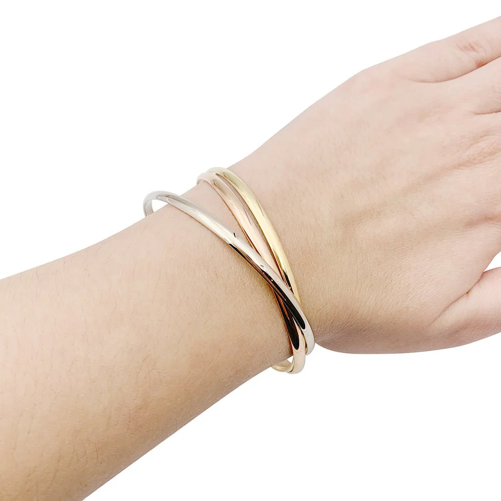 Bracelet Jonc Cartier "Trinity" en trois ors. - Image 2