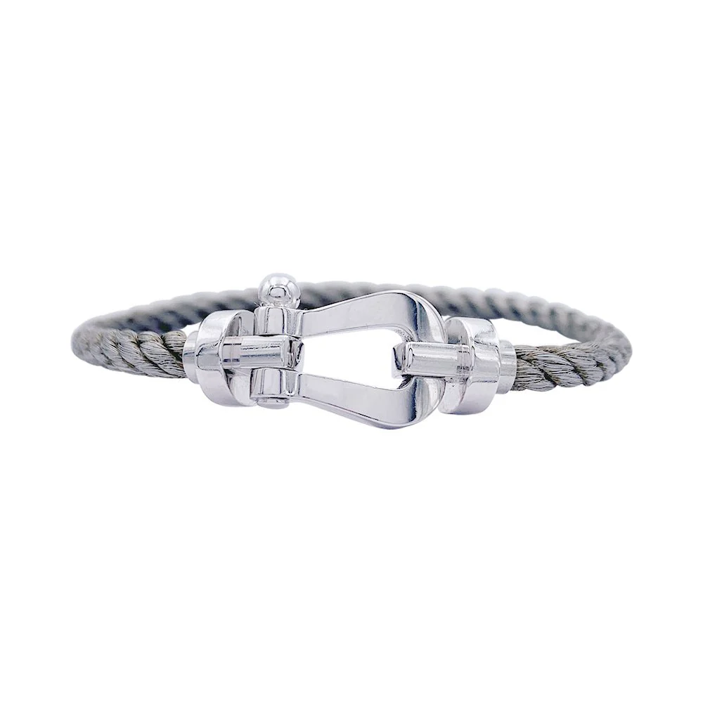 Bracelet Fred, "Force 10", en or blanc et acier.