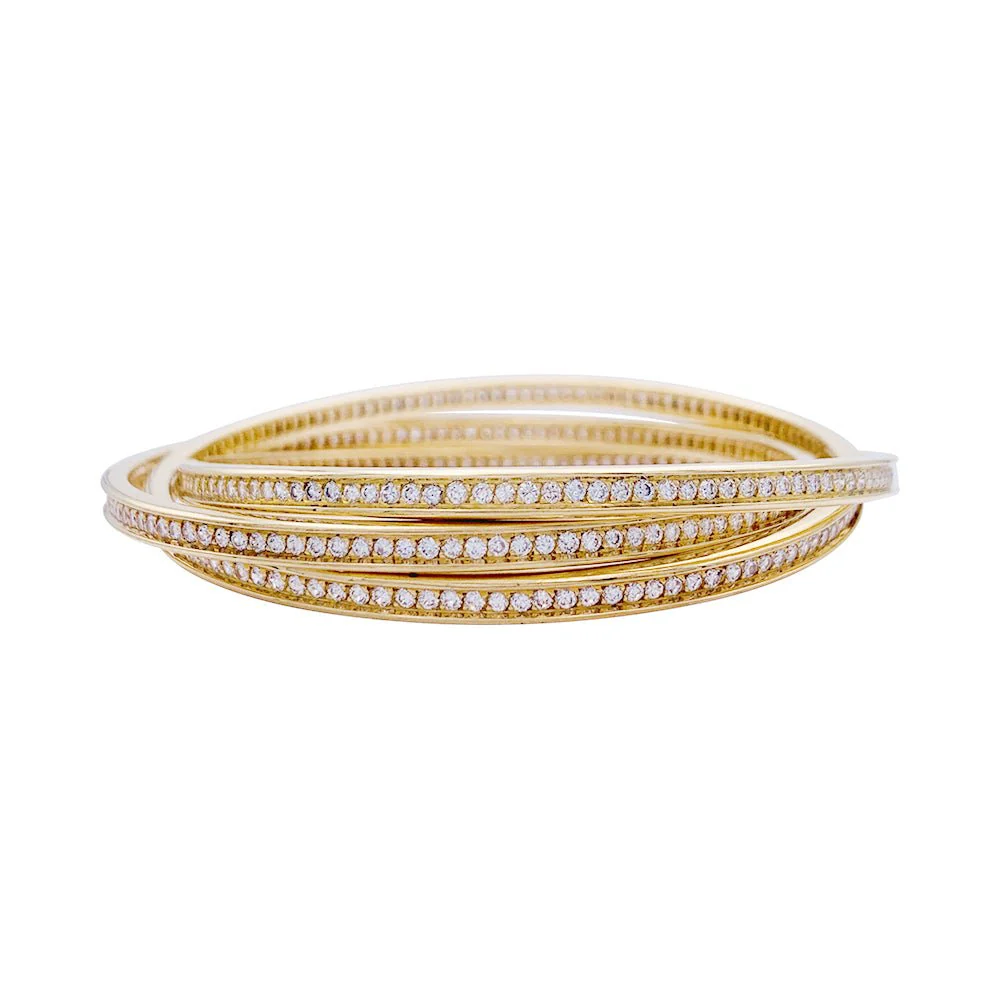 Bracelet triple joncs or jaune, diamants.