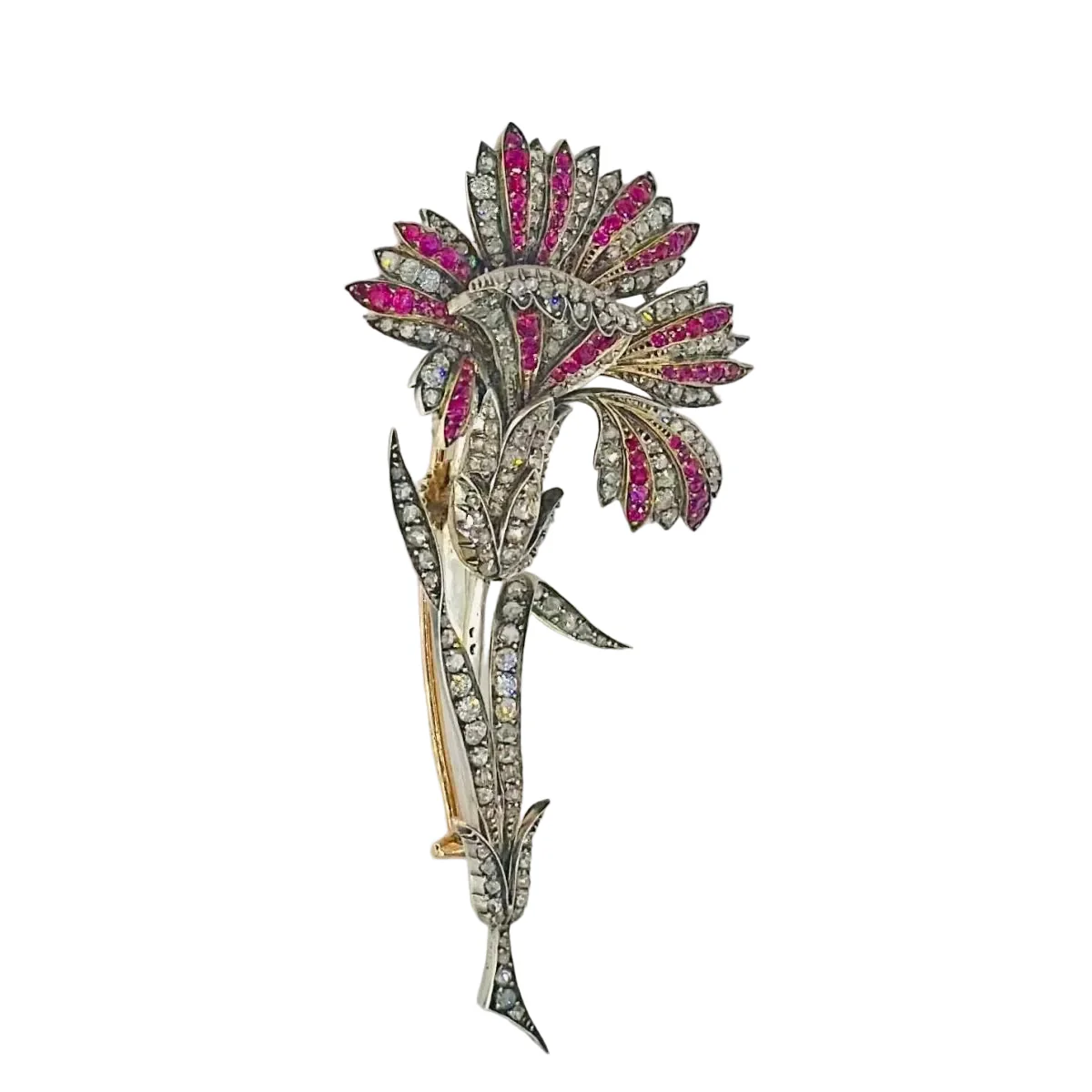 Broche Épingle en or jaune, argent, rubis et diamants