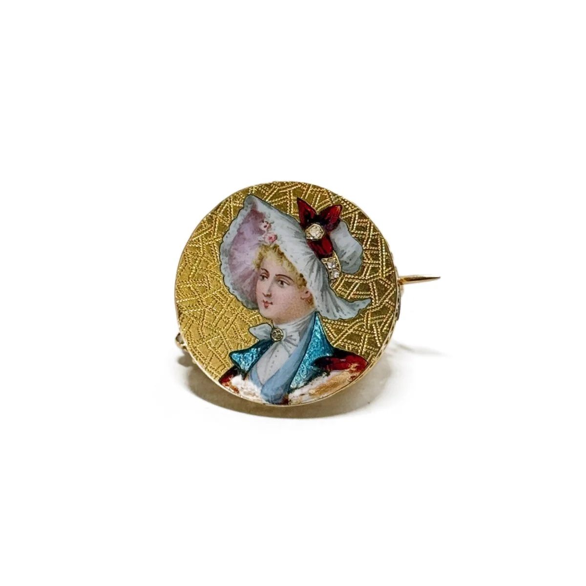 Broche femme au chapeau en or jaune et diamant