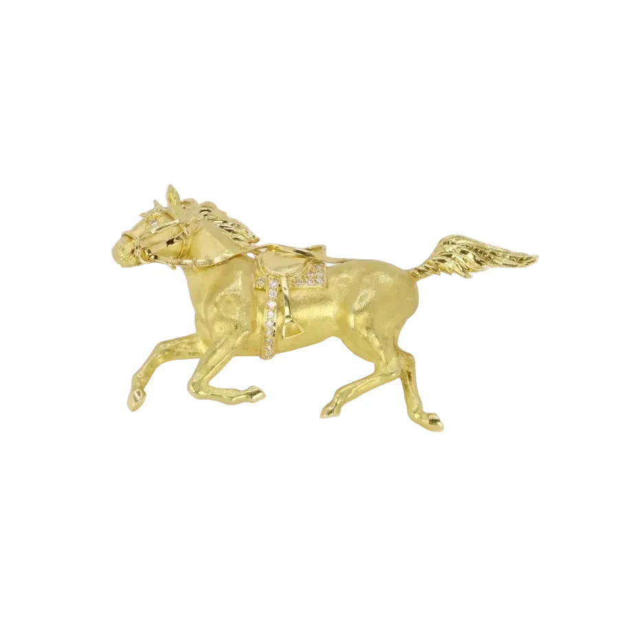 Broche animalière cheval en or jaune et diamants