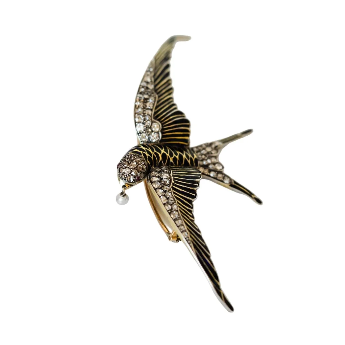 Broche "hirondelle" en or jaune et argent
