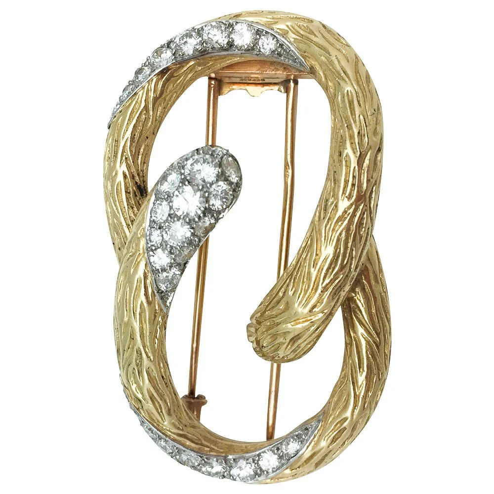 Broche MAUBOUSSIN "Boucle" en or jaune et platine, diamants