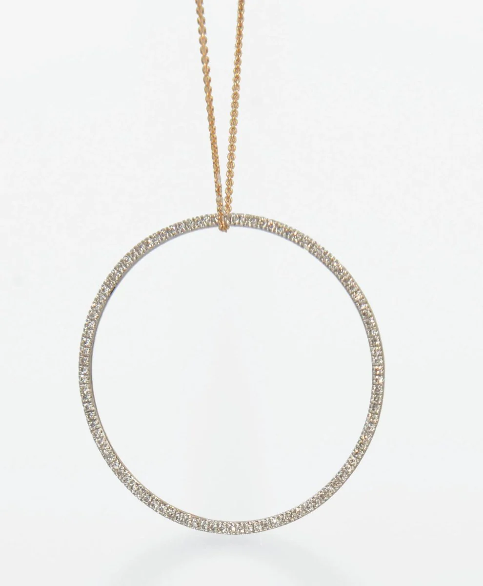 Pendentif signé Ginette NY en or rose avec un cercle en diamant