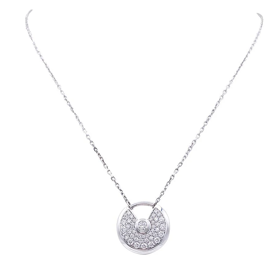 Collier Cartier, "Amulette", or blanc, diamants.