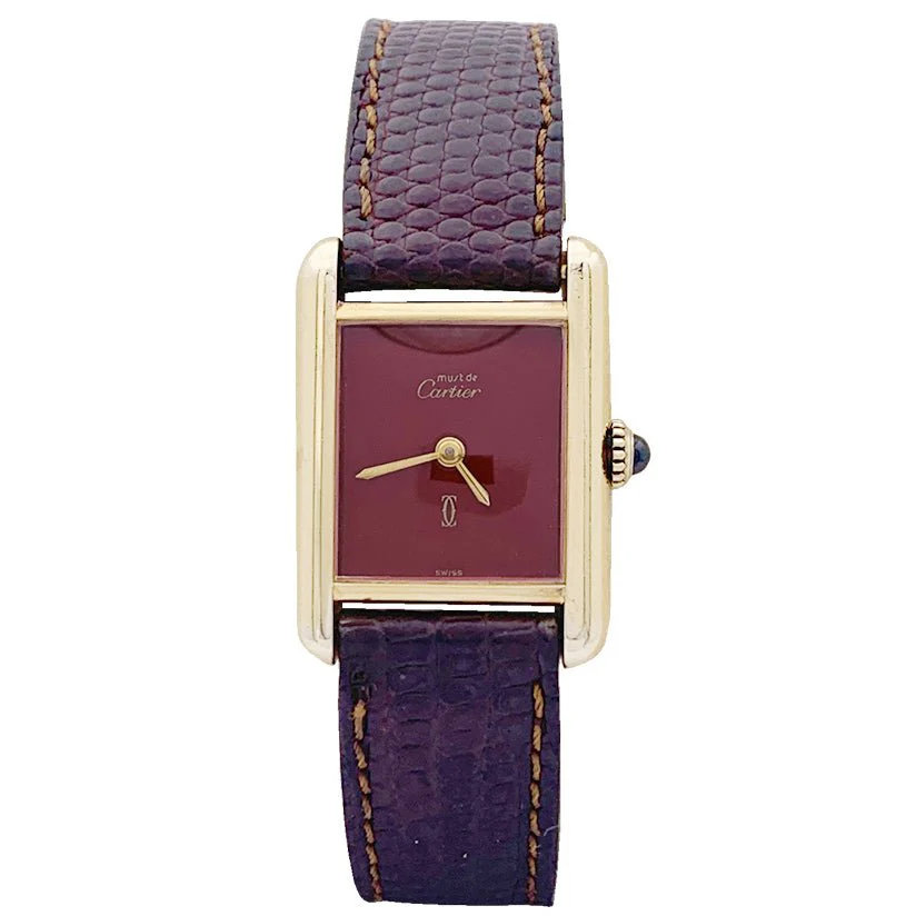 Montre CARTIER "Tank Must" argent plaqué or, cadran laqué rouge.