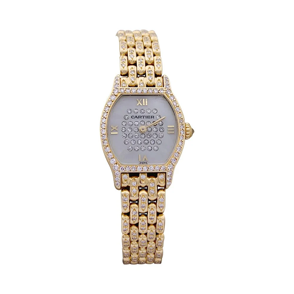 Montre Cartier "Tortue" or jaune, diamants, nacre.