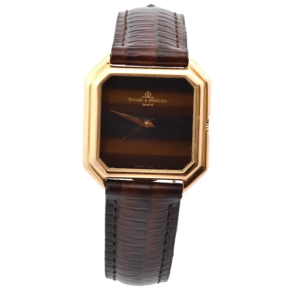 Montre BAUME & MERCIER en or jaune, cuir et saphir