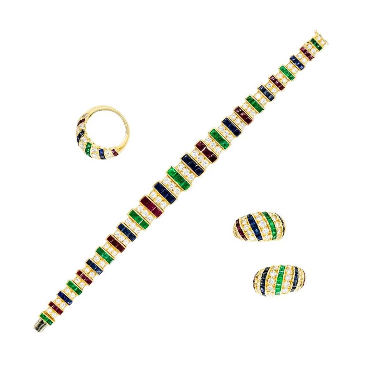 Parure CARTIER en or jaune, saphirs, émeraudes, rubis et diamants