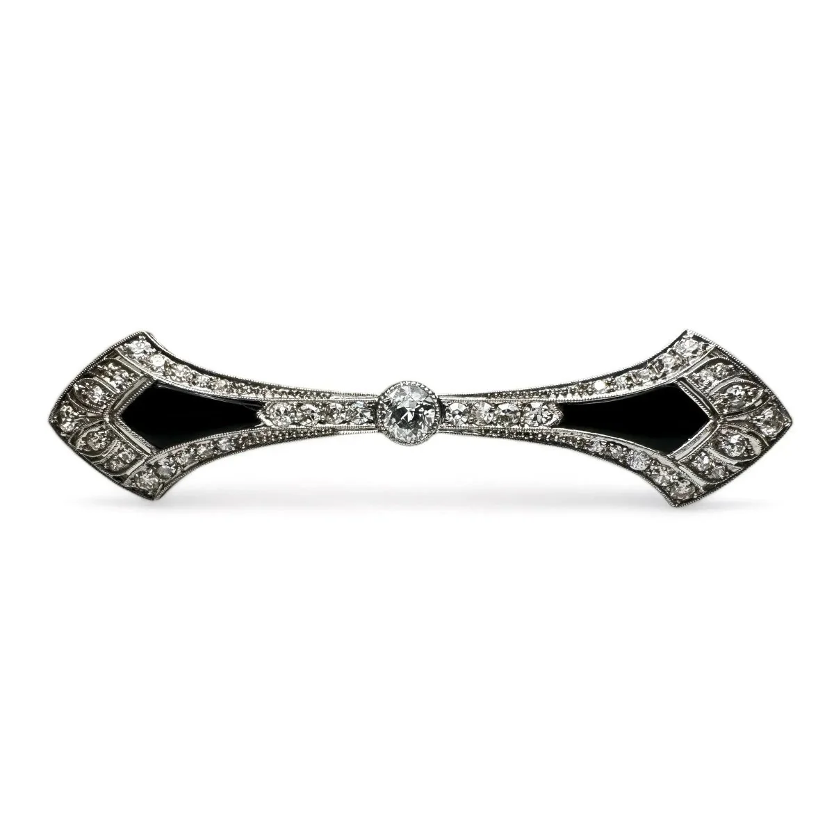 Broche barrette Art-Déco en platine, diamants et onyx.
